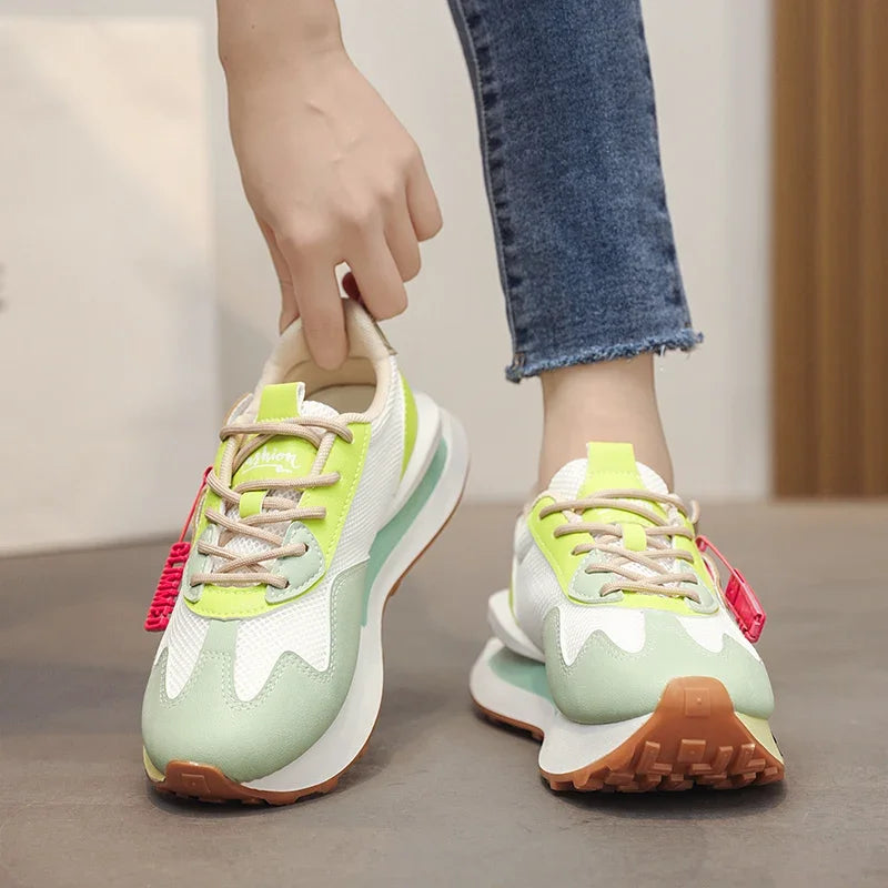 Retro pastel sneakers with neon accents and mesh sides